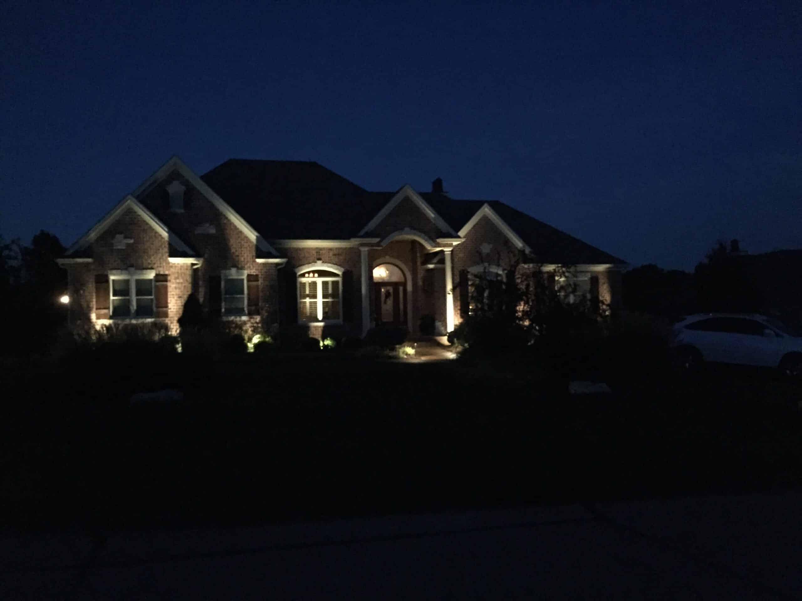 House at Night with Exterior Lighting