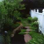 Decorative Walkway with a White Fence