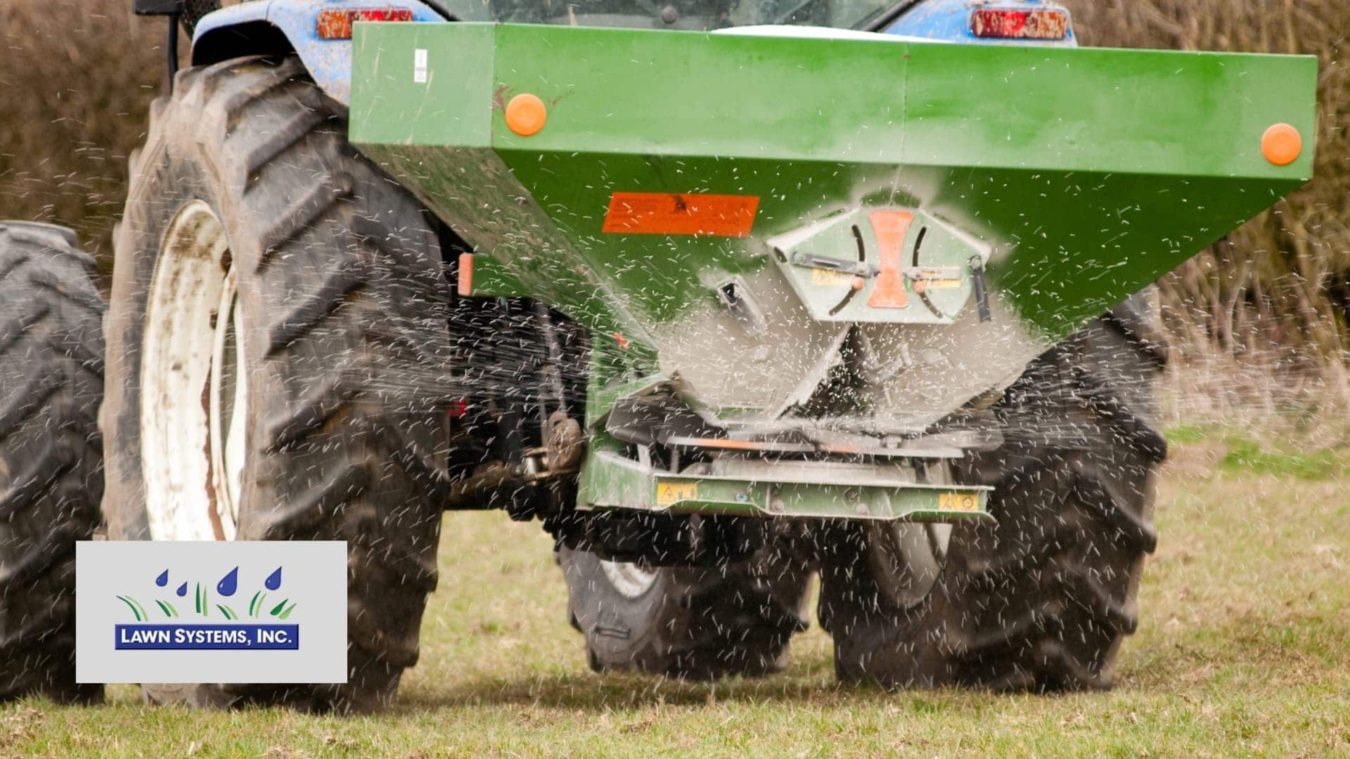 Tractor fertilizing lawn