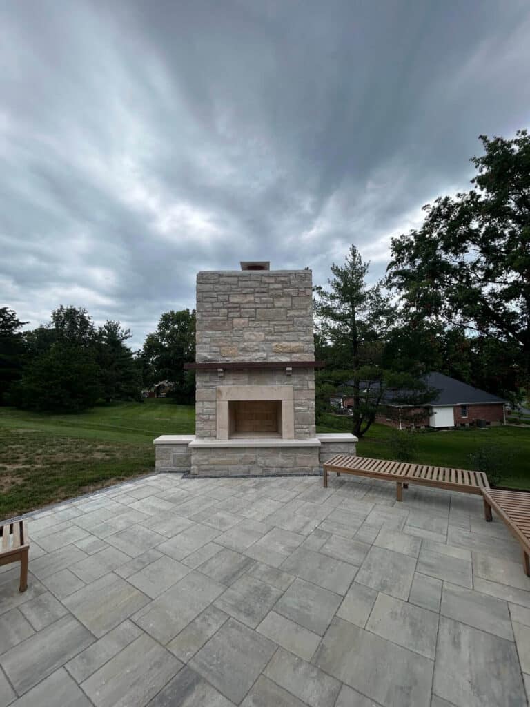 Stone patio with fireplace