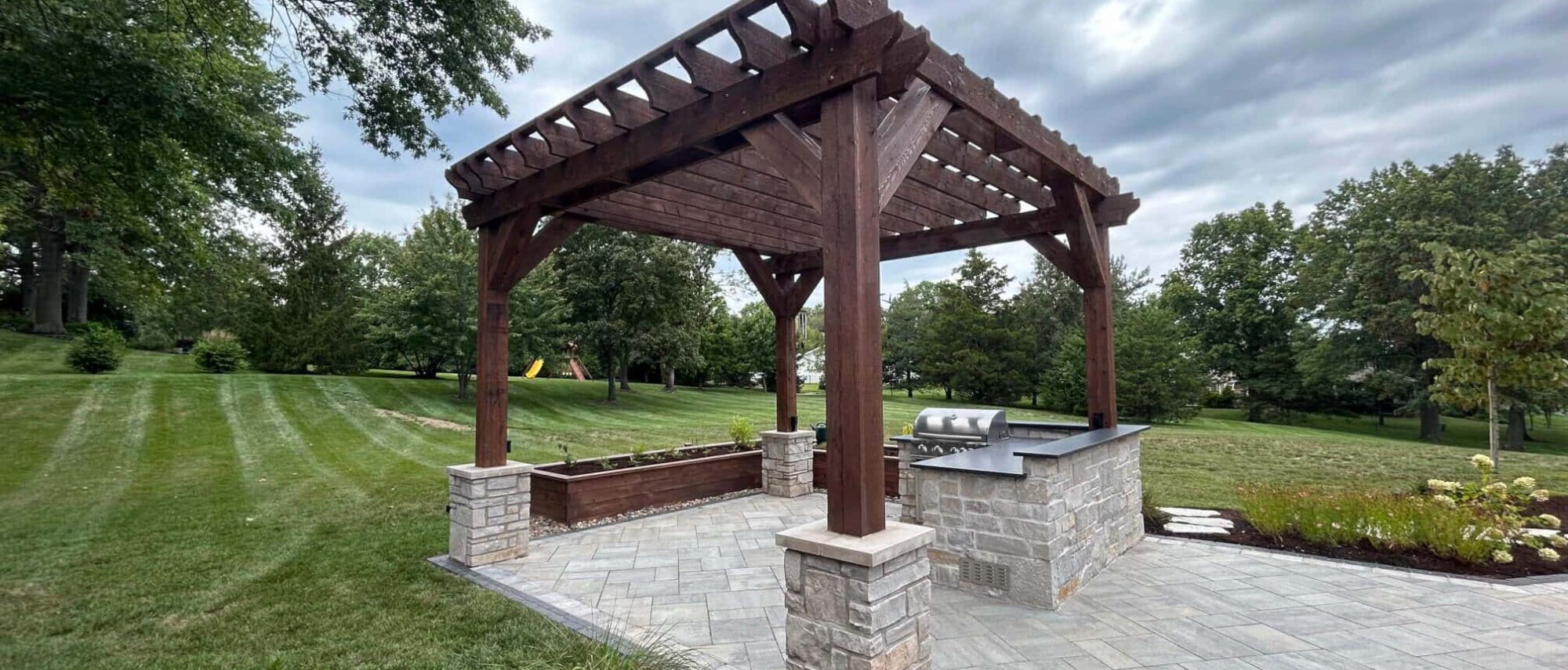 Pergola with stone pation and walkway