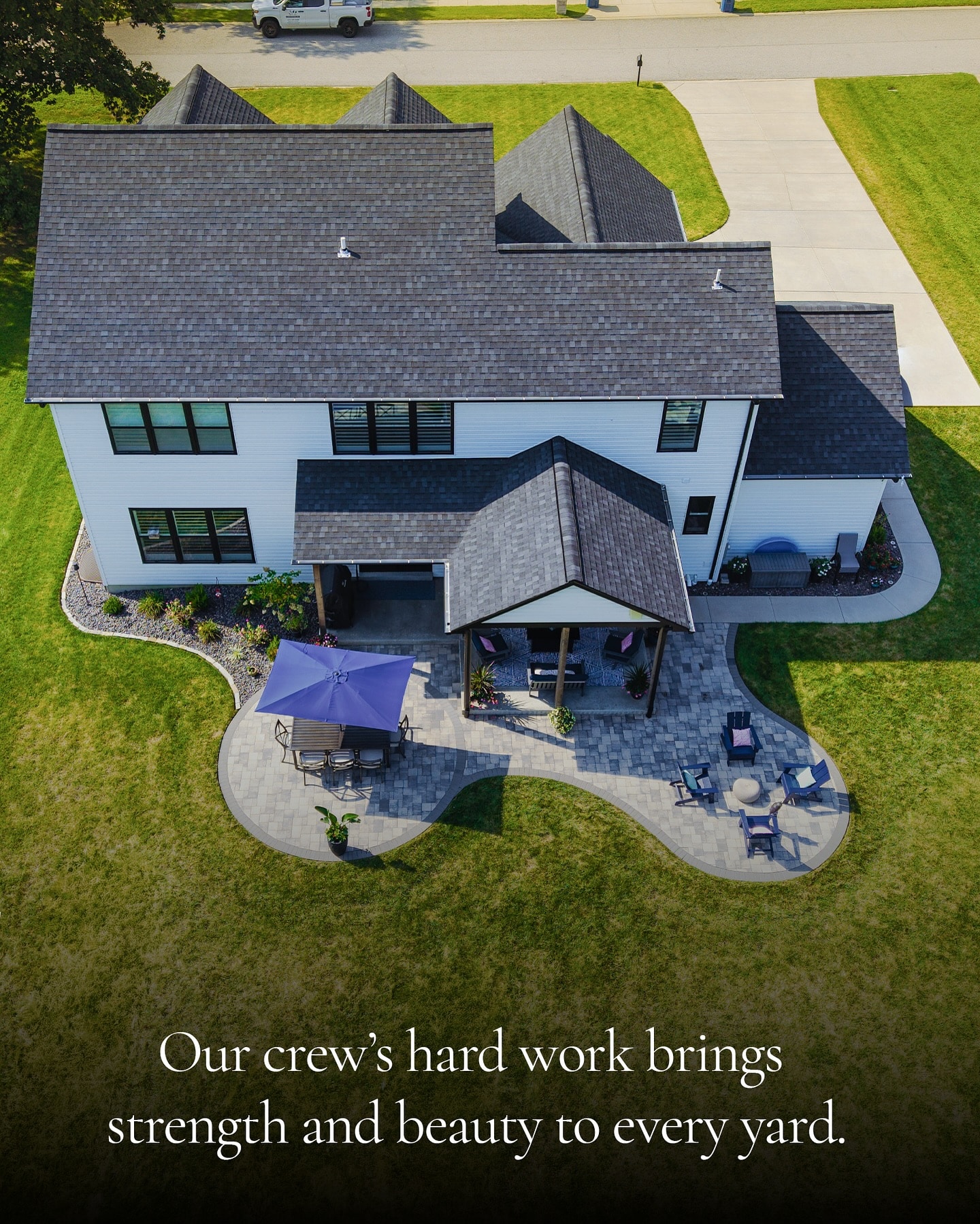 Lawn Systems Inc - Aerial shot of new home with new landscaping and patio furniture